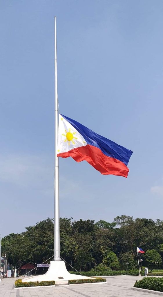 The flag of the Philippines at half mast.